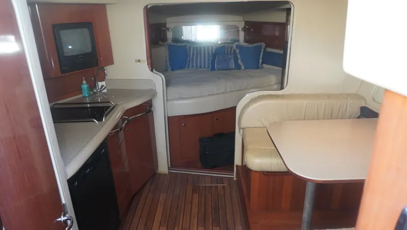 Slide: The Image of Interior of 2002 Sea Ray 340 Amberjack with kitchenette, dining area, and sleeping quarters. - 33