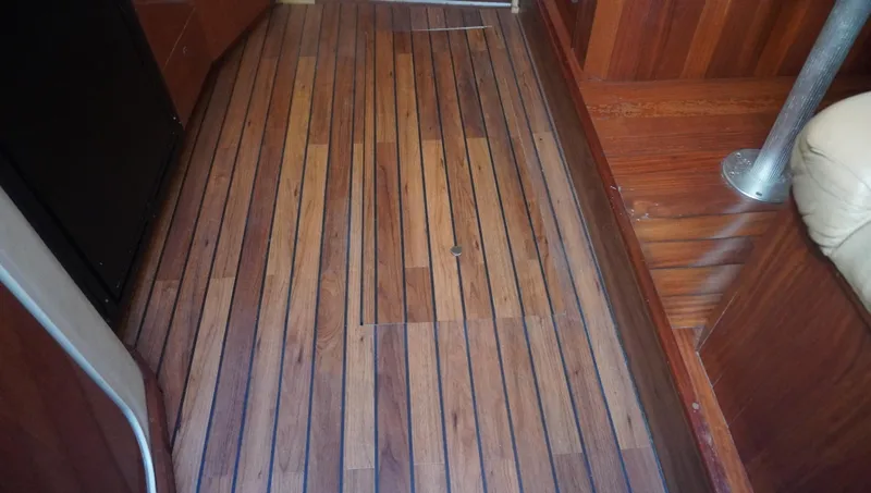 Slide: The Image of Teak flooring inside 2002 Sea Ray 340 Amberjack boat cabin. - 34