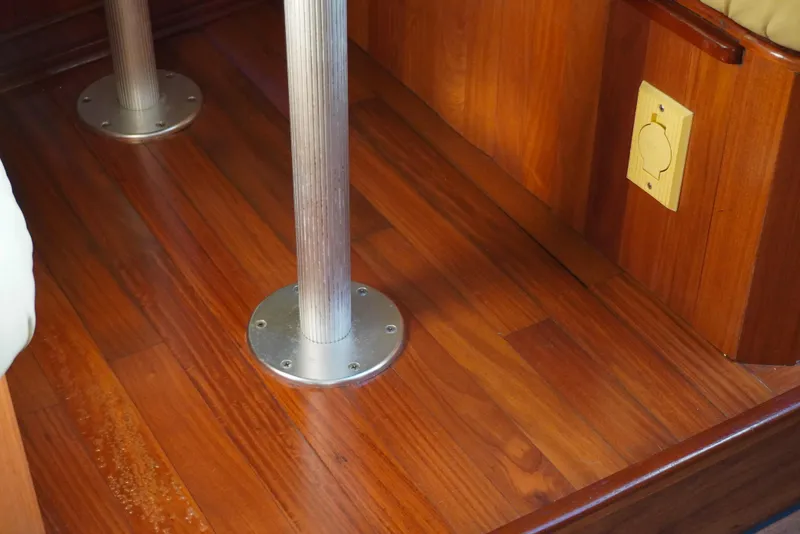 Slide: The Image of Wooden interior flooring of 2002 Sea Ray 340 Amberjack boat with metal fixtures. - 37