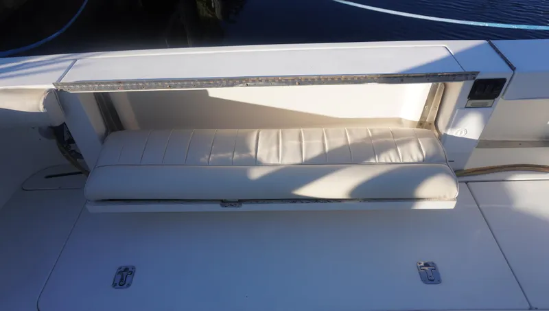 Slide: The Image of 2002 Sea Ray 340 Amberjack boat seat with storage compartment, white upholstery. - 45