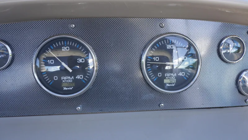 Slide: The Image of Dashboard gauges of a 2002 Sea Ray 340 Amberjack boat. - 46