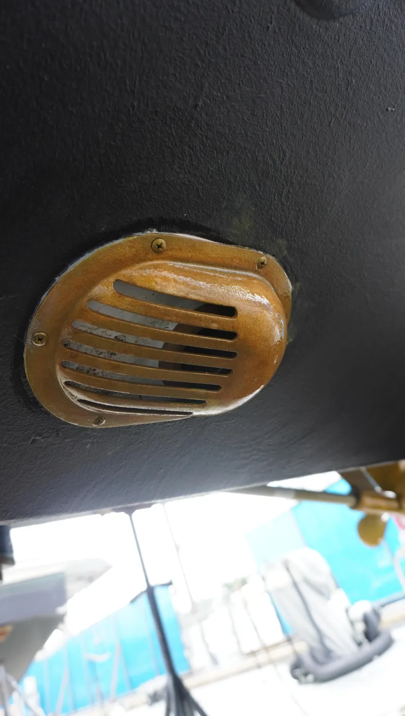 Slide: The Image of Close-up of a 2002 Sea Ray 340 Amberjack boat's brass vent. - 6