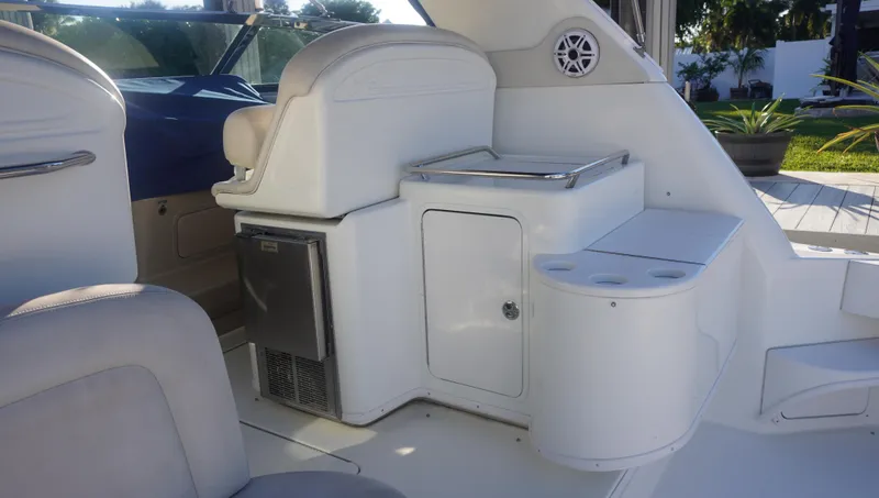 Slide: The Image of 2002 Sea Ray 340 Amberjack boat interior with seating and storage. - 9