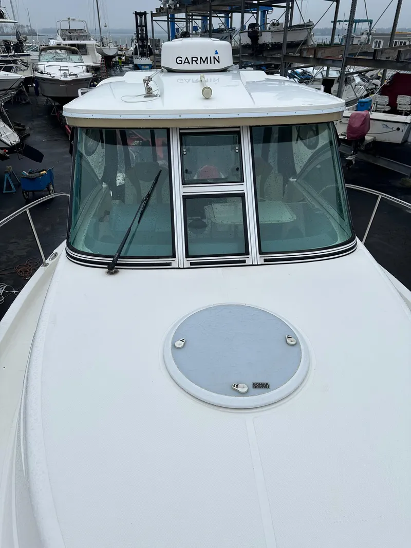 Slide: The Image of 2017 Striper 270 Walkaround boat with Garmin equipment, docked in a marina. - 8