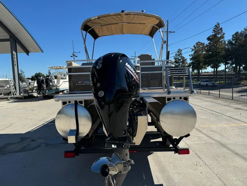 Slide: The Image of 2025 Sun Tracker 24 Sportfish XP3 pontoon boat with Mercury outboard motor. - 8