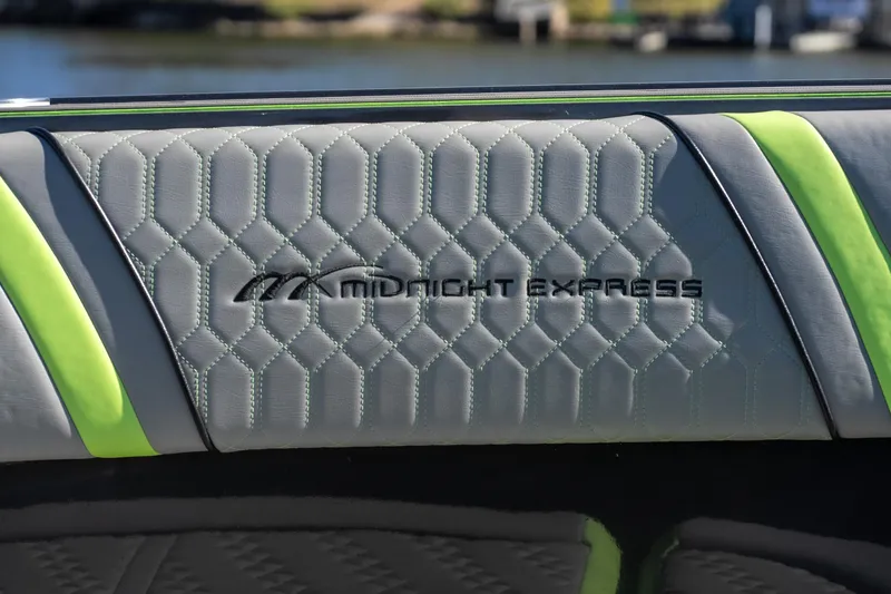 Slide: The Image of Midnight Express 43 Solstice 2022 boat interior with quilted upholstery and logo. - 15