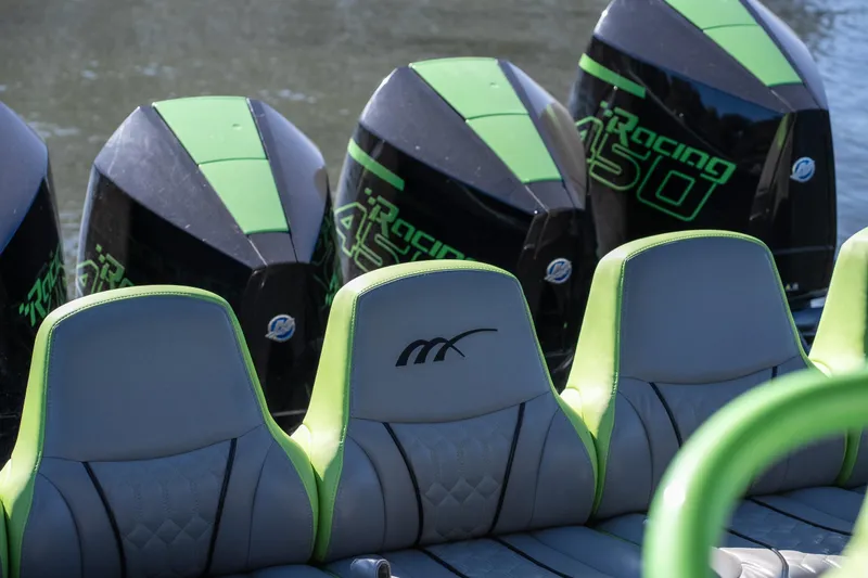 Slide: The Image of Midnight Express 43 Solstice 2022 boat with green-accented seats and powerful Racing 450 engines. - 18