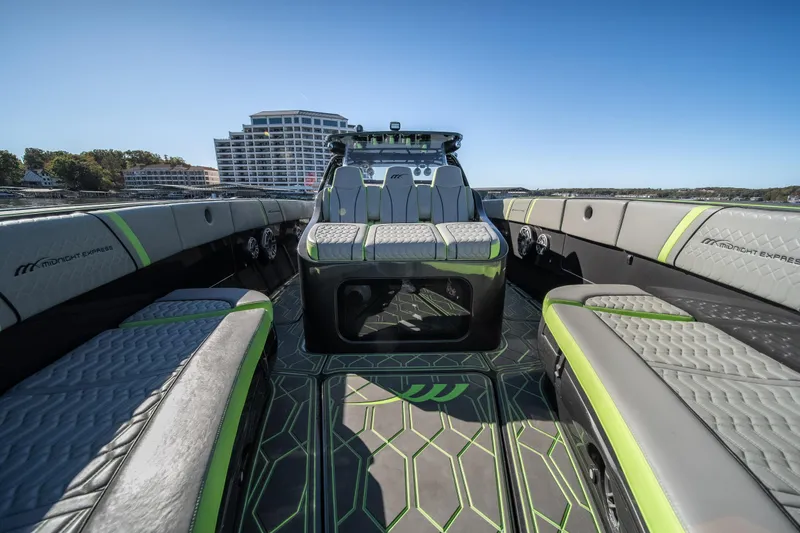 Slide: The Image of 2022 Midnight Express 43 Solstice luxury boat interior with modern seating and sleek design. - 25