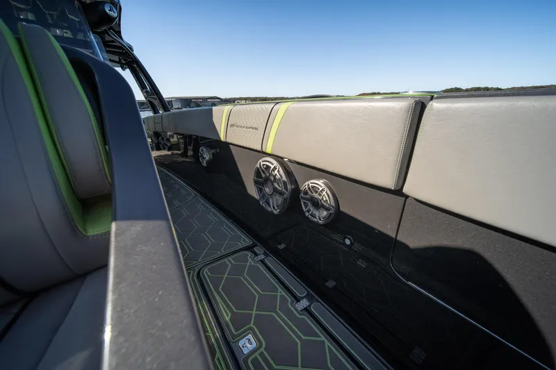 Slide: The Image of Interior of 2022 Midnight Express 43 Solstice boat with sleek seating and modern speakers. - 26