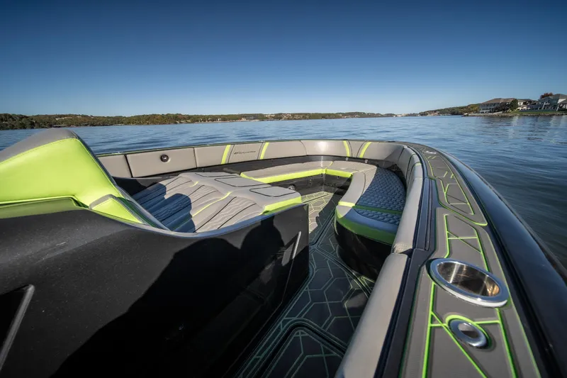 Slide: The Image of 2022 Midnight Express 43 Solstice boat interior with sleek design on a calm lake. - 27