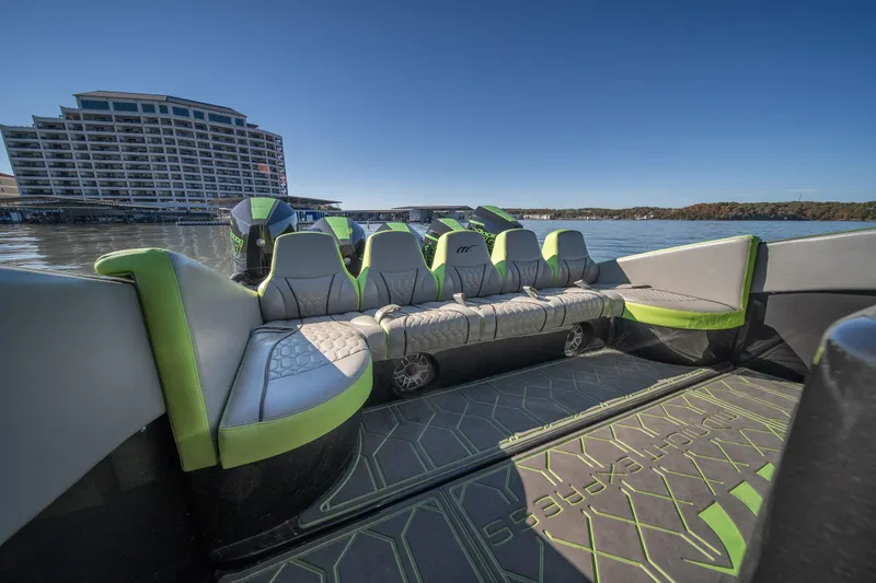 Slide: The Image of Luxury seating on 2022 Midnight Express 43 Solstice boat, with scenic waterfront view. - 29