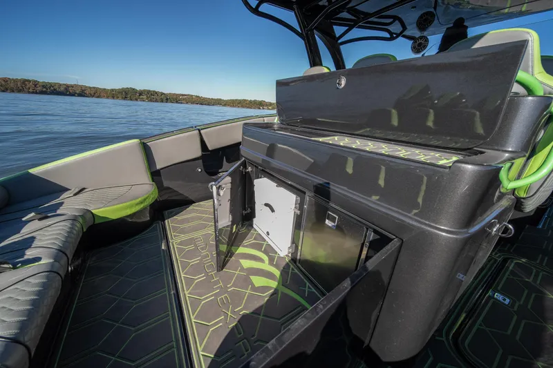 Slide: The Image of 2022 Midnight Express 43 Solstice boat interior with open storage, sleek design, and lake view. - 33