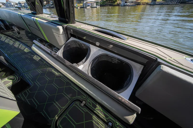 Slide: The Image of 2022 Midnight Express 43 Solstice boat interior with cup holders and stylish seating. - 36