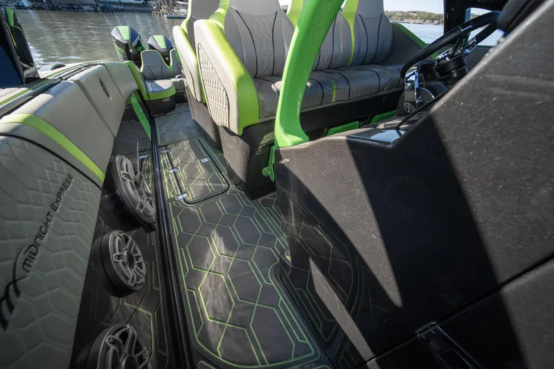 Slide: The Image of 2022 Midnight Express 43 Solstice interior with modern design and green accents. - 38