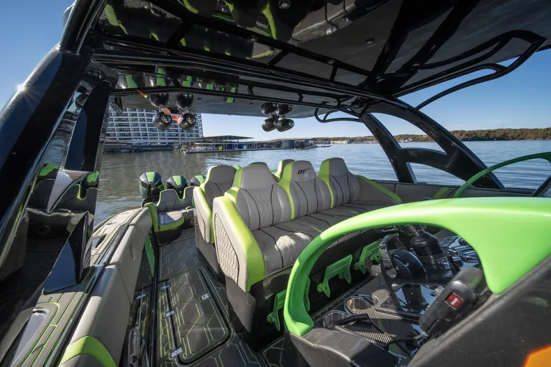Slide: The Image of 2022 Midnight Express 43 Solstice boat interior with modern design and green accents. - 39