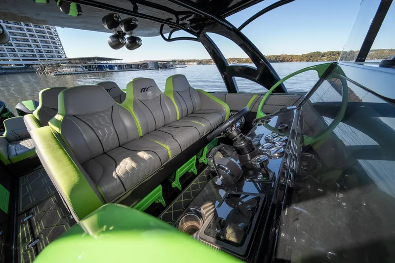 Slide: The Image of Luxurious 2022 Midnight Express 43 Solstice boat interior with modern seating and sleek dashboard. - 40