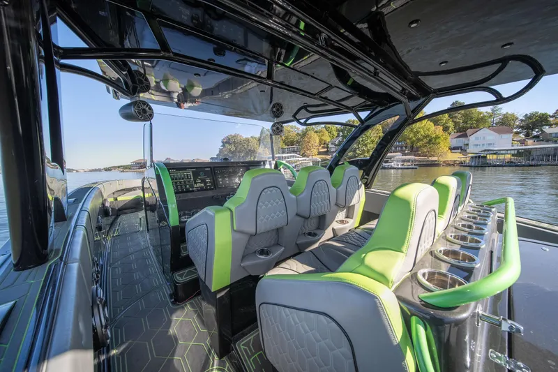 Slide: The Image of Interior of 2022 Midnight Express 43 Solstice boat with modern seating and sleek design. - 44
