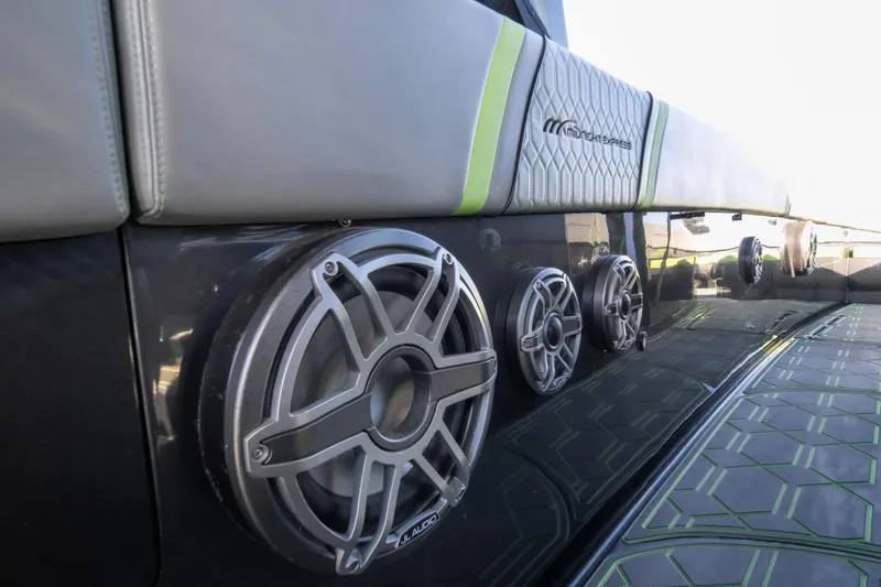 Slide: The Image of 2022 Midnight Express 43 Solstice boat with sleek speakers and modern design. - 49