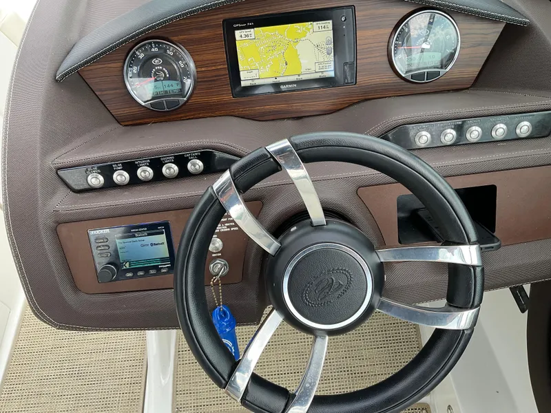 Slide: The Image of 2016 Cobalt R5 boat dashboard with steering wheel and navigation system. - 10