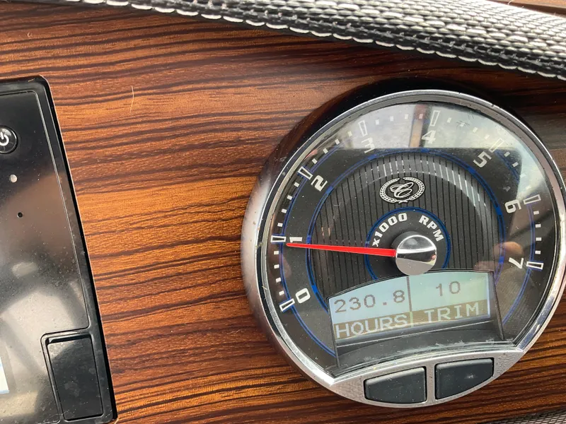 Slide: The Image of 2016 Cobalt R5 dashboard with wood grain finish and RPM gauge. - 13