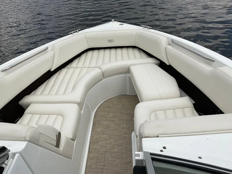 Slide: The Image of 2016 Cobalt R5 boat with luxurious white seating on calm water. - 5