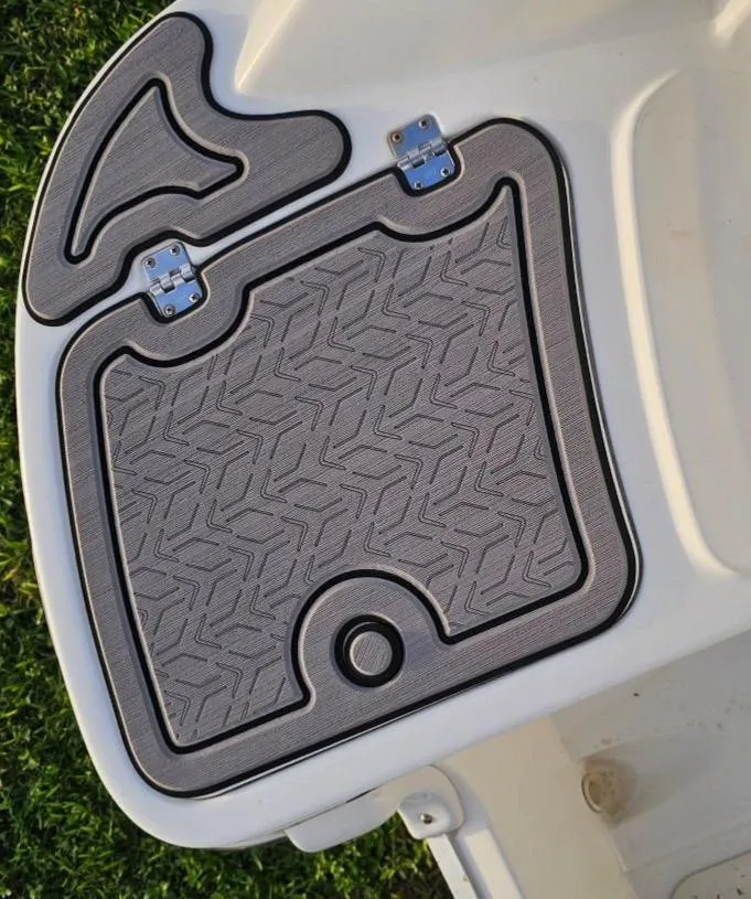 Slide: The Image of 2016 Hurricane SD2200 O/B boat deck with textured mat and hinges. - 10