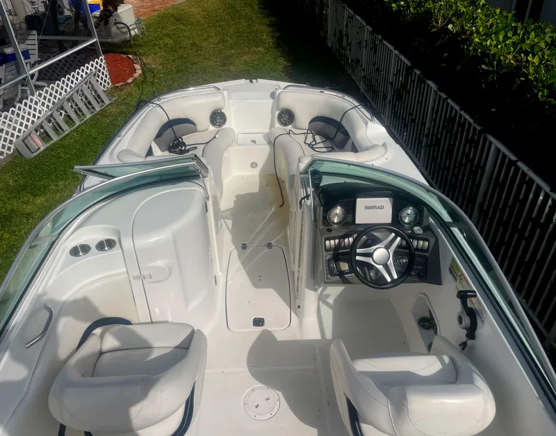 Slide: The Image of 2016 Hurricane SD2200 O/B boat interior with seating and steering wheel. - 5