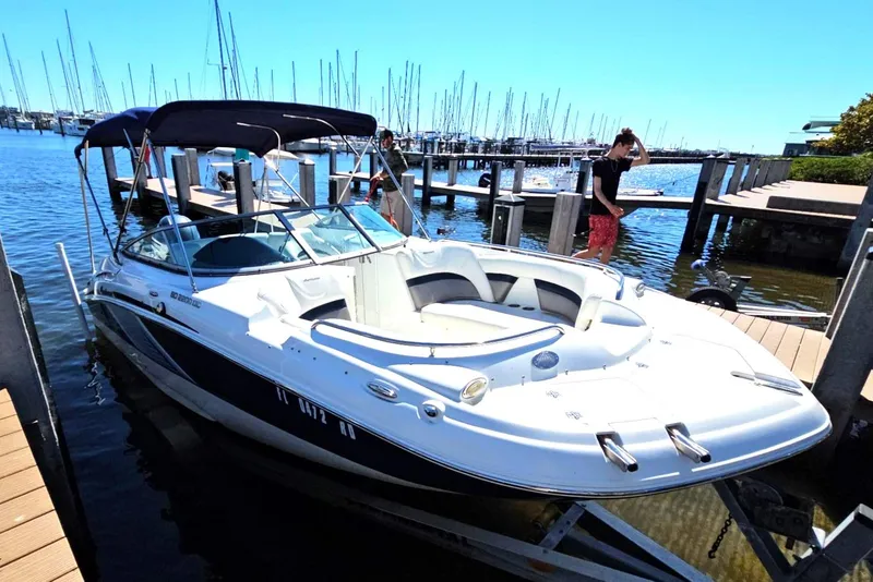 Slide: The Image of 2016 Hurricane SD2200 O/B boat docked at marina under clear blue sky. - 9