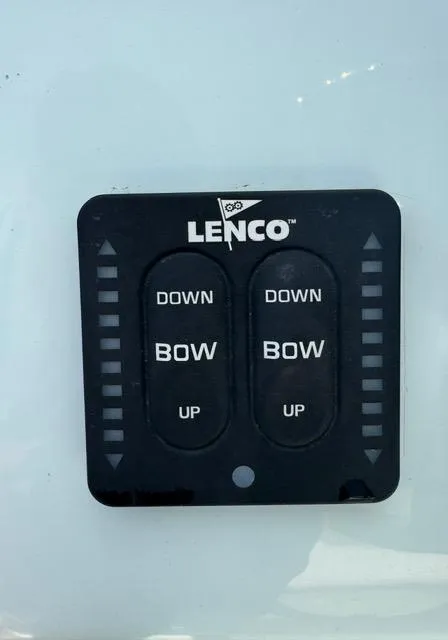 Slide: The Image of Lenco trim tab control panel on 2024 Action Craft 22 Coastal Bay boat. - 16