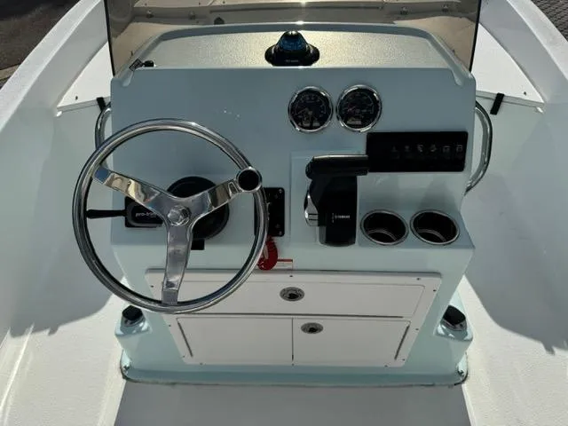 Slide: The Image of 2024 Action Craft 22 Coastal Bay boat console with steering wheel and gauges. - 20