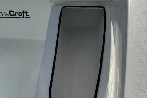 Slide: The Image of 2024 Action Craft 22 Coastal Bay boat storage compartment detail. - 28