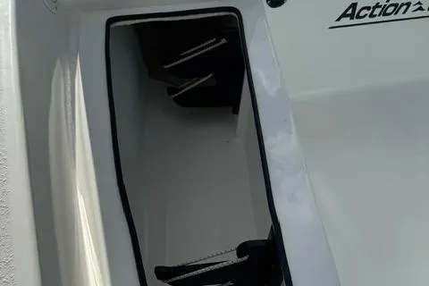 Slide: The Image of 2024 Action Craft 22 Coastal Bay boat storage compartment, open and empty. - 29