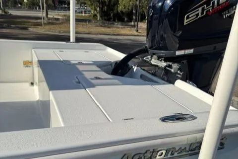 Slide: The Image of 2024 Action Craft 22 Coastal Bay boat with powerful engine, sleek design, and spacious deck. - 30