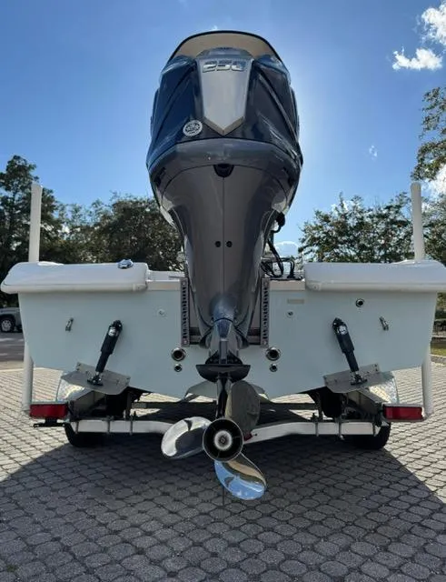 Slide: The Image of 2024 Action Craft 22 Coastal Bay boat with powerful outboard motor, rear view. - 31