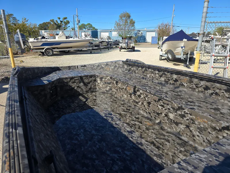 Slide: The Image of 2025 Edge Duck Boats ̃̀̉̃756DB with camouflage design in a boatyard. - 12