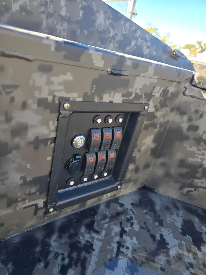 Slide: The Image of 2025 Edge Duck Boats 756DB control panel with camouflage design. - 13