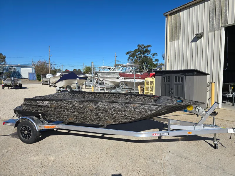 Slide: The Image of 2025 Edge Duck Boats ̃̀̉̃756DB on trailer, parked outside a warehouse. - 3