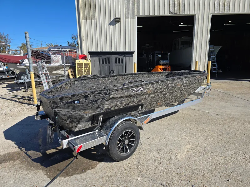 Slide: The Image of 2025 Edge Duck Boats ̃̀̉̃756DB on trailer outside a workshop. - 7