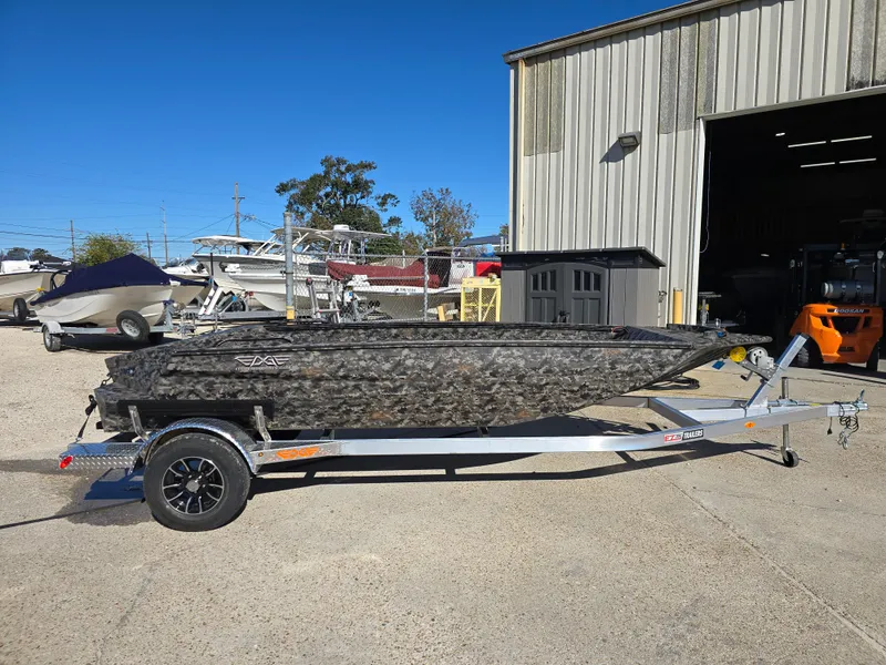 Slide: The Image of 2025 Edge Duck Boats ̃̀̉̃756DB on trailer outside a warehouse. - 8