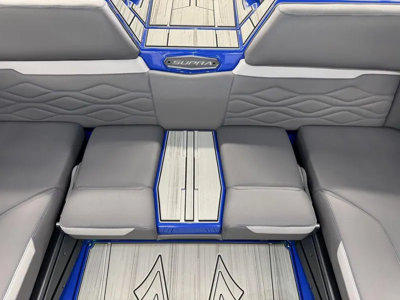 Slide: The Image of 2025 Supra SA 450 interior with sleek gray seating and modern design accents. - 18
