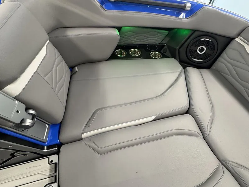 Slide: The Image of Interior of 2025 Supra SA 450 boat with gray seating and speaker system. - 20