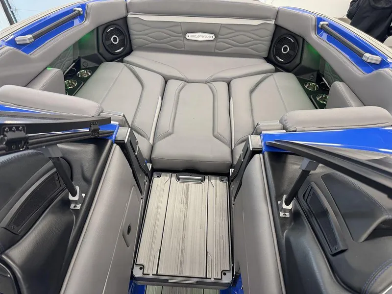 Slide: The Image of 2025 Supra SA 450 boat interior with gray seating and integrated speakers. - 22