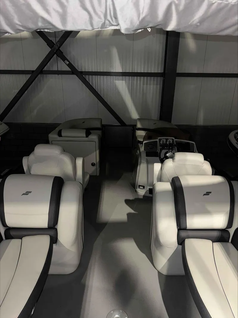 Slide: The Image of Interior of 2022 Starcraft EXS 3 boat with white and black seating. - 5