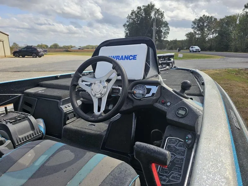 Slide: The Image of 2017 Skeeter FX20 LE boat interior with steering wheel and dashboard controls. - 10