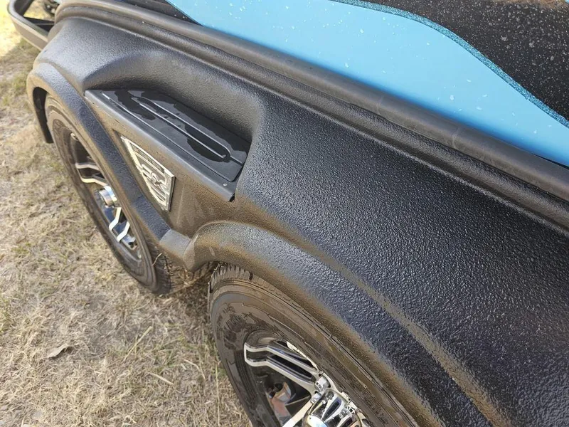 Slide: The Image of 2017 Skeeter FX20 LE boat trailer with black textured fender and chrome wheels. - 6