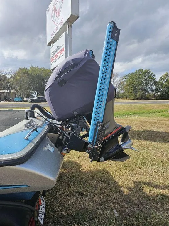 Slide: The Image of 2017 Skeeter FX20 LE boat with motor and power pole on grassy area. - 8