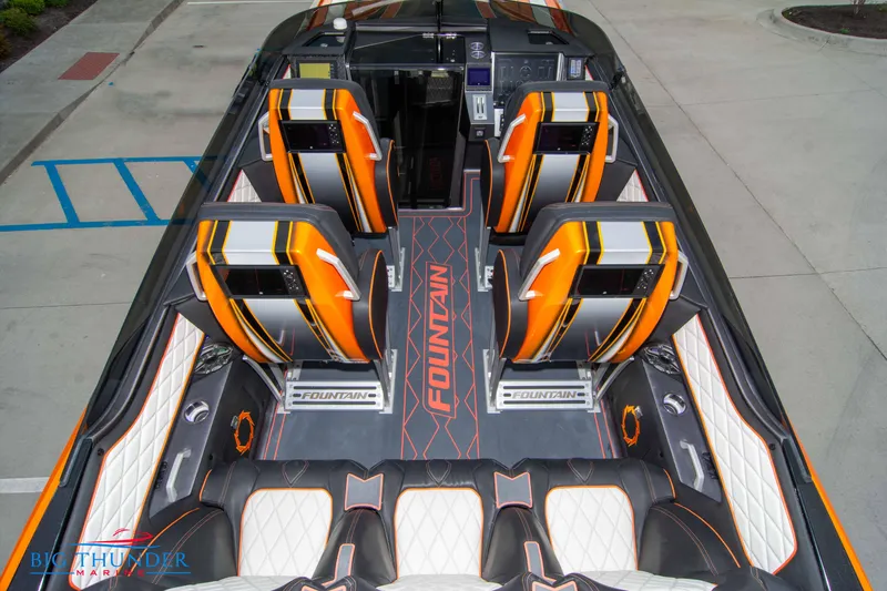 Slide: The Image of 2020 Fountain 47 Lightning boat interior with orange and black seats, sleek design. - 19