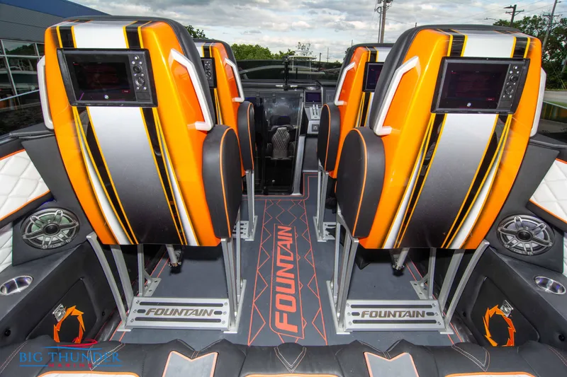Slide: The Image of 2020 Fountain 47 Lightning boat interior with vibrant orange and black seating. - 20
