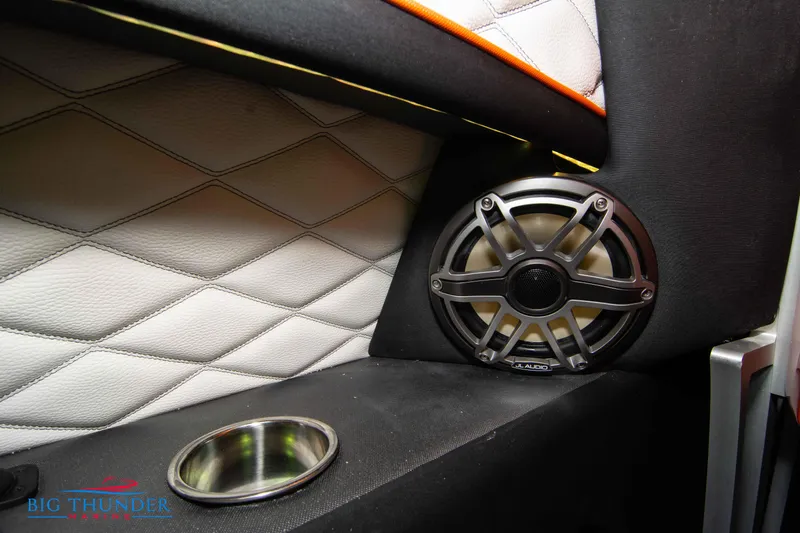 Slide: The Image of 2020 Fountain 47 Lightning interior with speaker and cup holder detail. - 25