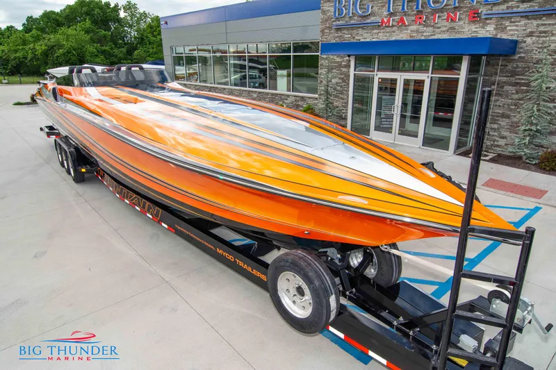 Slide: The Image of 2020 Fountain 47 Lightning speedboat in vibrant orange at Big Thunder Marine dealership. - 3
